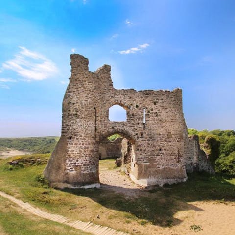 Visit King Arthur's Stone and Weobley Castle, both within driving distance