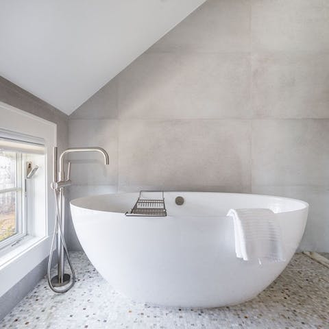 Run yourself a relaxing bubble bath in the freestanding tub