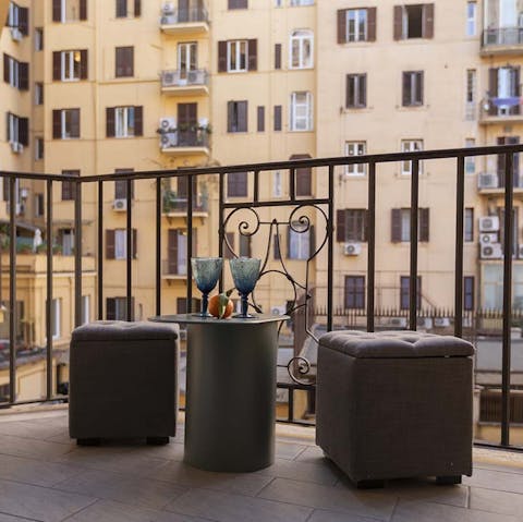 Enjoy a glass of local wine on the small balcony