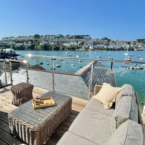 Enjoy sundowners on the terrace while watching boats glide by