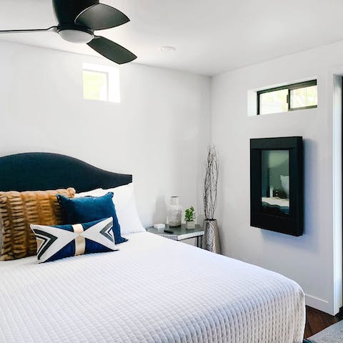 Get a restful night's sleep in the modern bedrooms with sleek exposed beams
