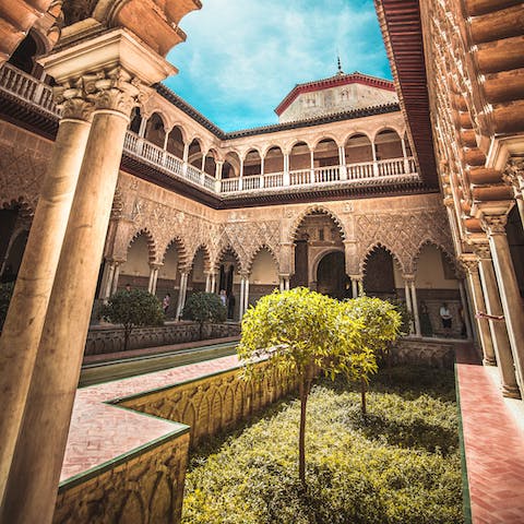 Admire the intricacies of the Royal Alcázar, a short walk away