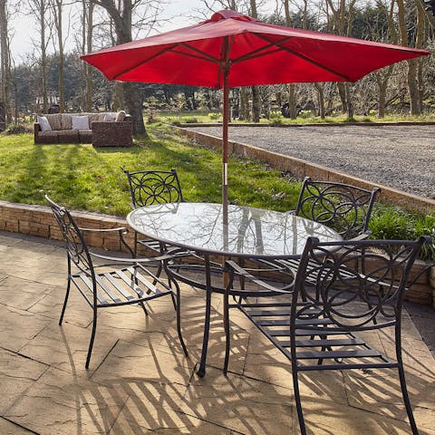 Tuck into tasty English fare alfresco on your patio dining set
