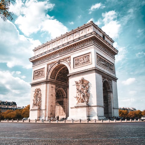 Visit the Arc de Triomphe, a ten-minute walk away