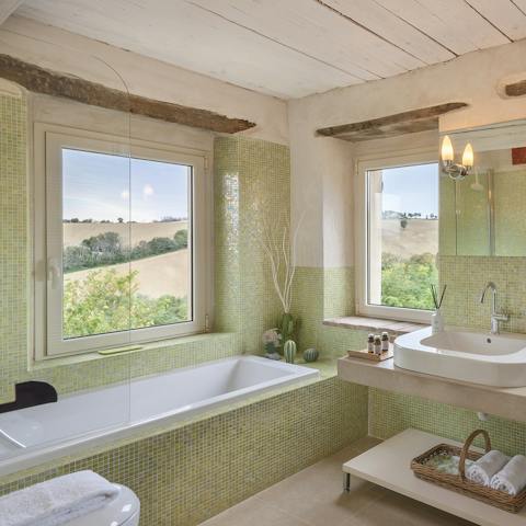 Unwind after a day of exploring the local village in the bathtub, complete with gorgeous views