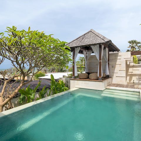 Spend lazy afternoons relaxing in a shady spot by the private pool