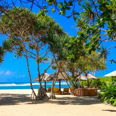 Soak up the sunshine on Batu Belig Beach, footsteps from the villa