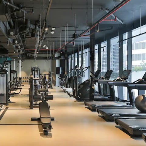 Bank a workout in the impressive shared fitness centre overlooking the pool