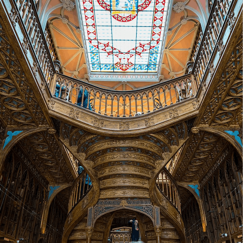 Visit the beautiful Livraria Lello bookshop, a thirteen-minute walk away