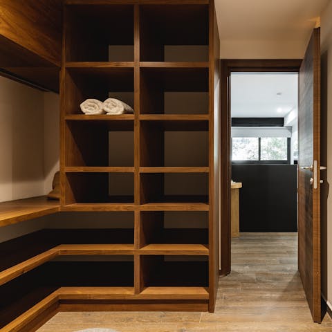Bring your whole wardrobe with you with a walk in closet to unpack into
