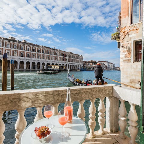 Watch the boats pass by over breakfast on the balcony