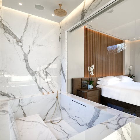 Relax in the large marble Jacuzzi bathtub in the main en-suite bathroom