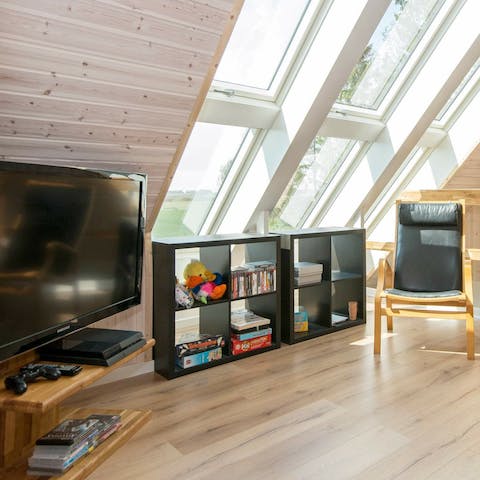 Kick back in the upstairs entertainment space with sunlight streaming in
