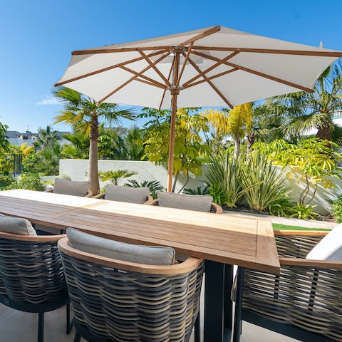 Eat alfresco breakfasts amidst the tropical fauna and flora of the balcony terrace 