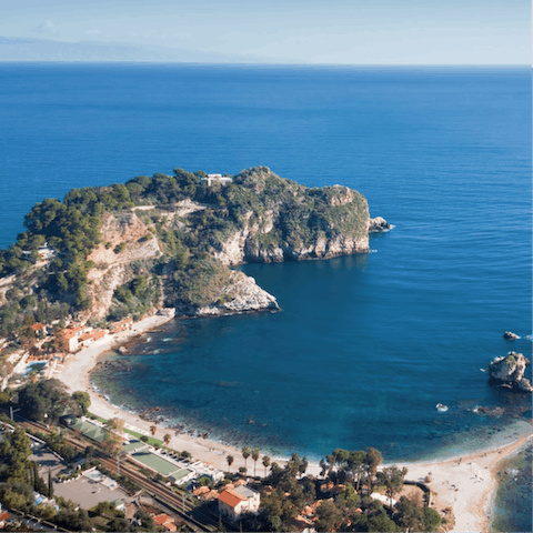 Drive to the striking bay of Isola Bella in just forty minutes