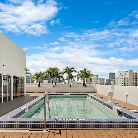 Enjoy a cooling dip in the rooftop pool overlooking the ocean