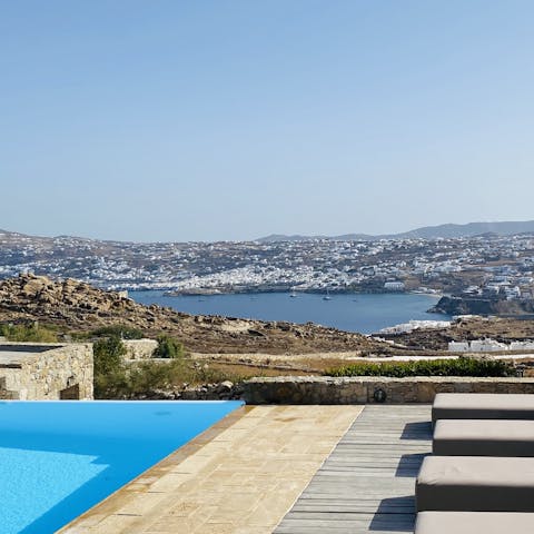 Take in far-reaching views over Mykonos Town from your privileged hilltop location