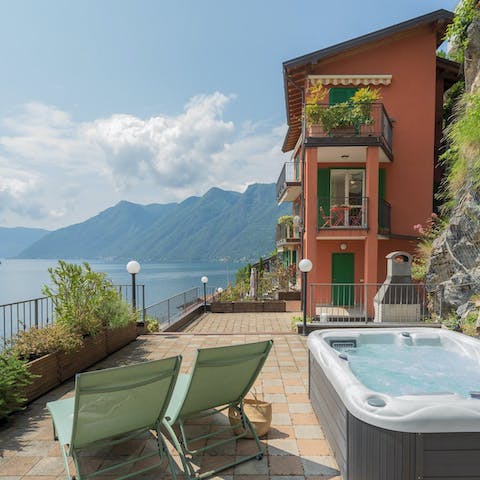 Drink in the stunning lake views from the private Jacuzzi