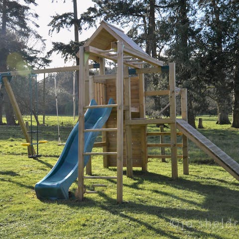 Keep the kids entertained on the wooden climbing frame