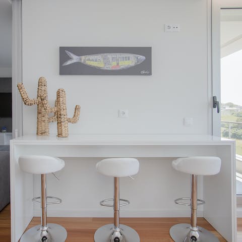 Enjoy a light bite and a drink on your bar style table