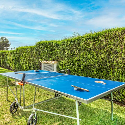 Challenge friends to a game of ping pong in the garden