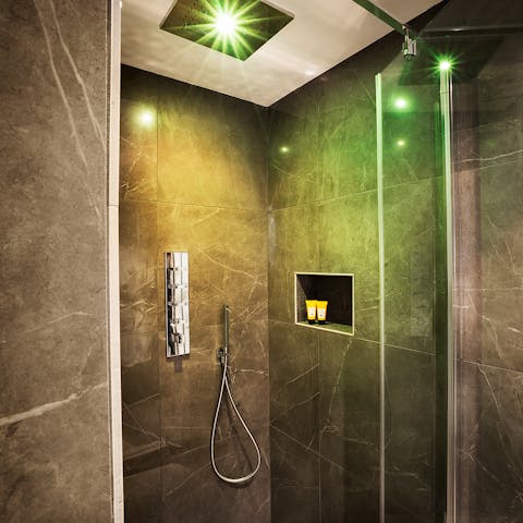 Relax sore muscles after a long day in the chromotherapy rainfall shower