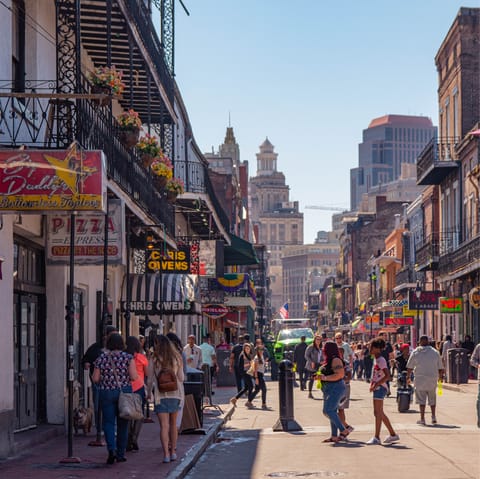 Ride the streetcar to Bourbon Street, twenty minutes away, and soak up the magic of New Orleans