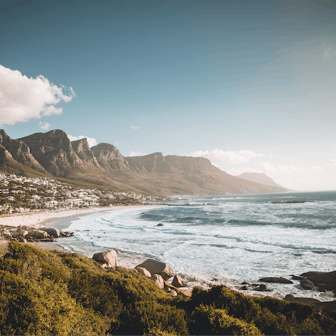 Take surf lessons at Camps Bay Beach – it's ten minutes away by car
