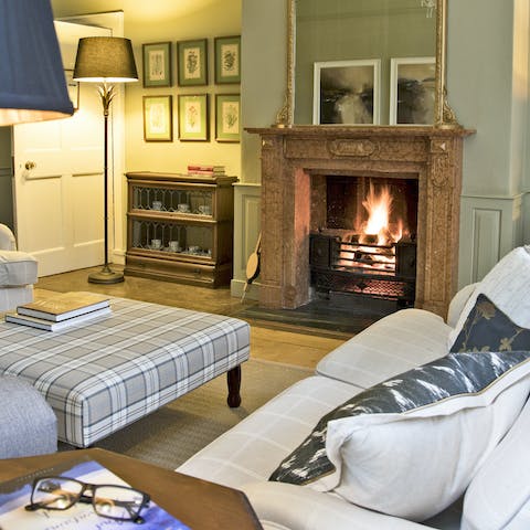 Cosy up by the open fire after a day spent hiking or biking up hill and down dale