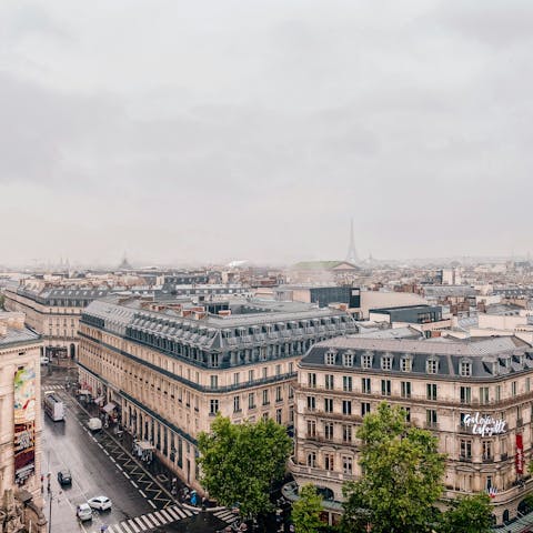 Stroll down the bustling Grands Boulevards in the heart of Paris
