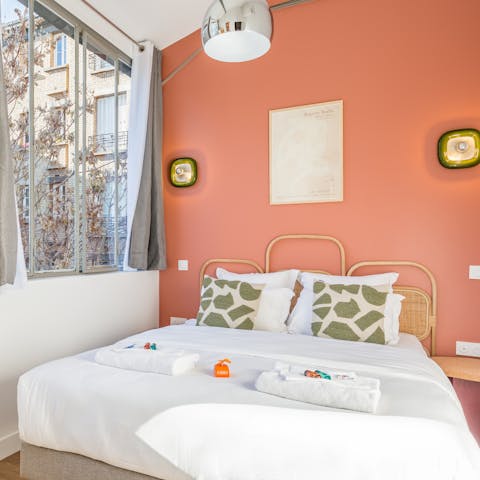 Wake up to leafy courtyard views in the pastel-coloured bedrooms