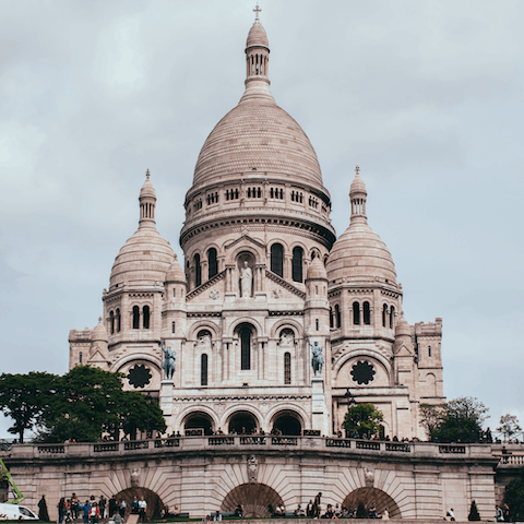 Gaze up at the iconic Sacré-Cœur Basilica in Montmartre, a fifteen-minute walk away