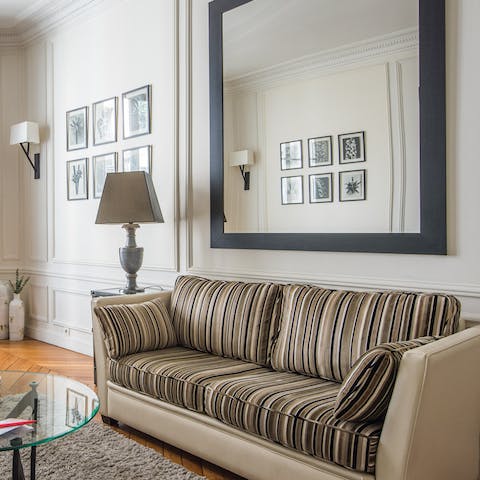 Unwind in the luxurious living room after a day of visiting museums and monuments in Paris 