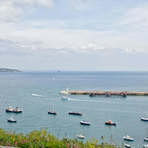 Watch fishing boats bob about in Brixham Harbour from the comfort of the window seat
