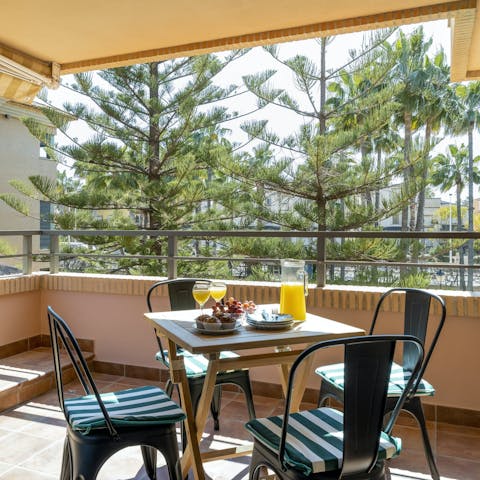 Soak up the sun over an alfresco breakfast on the private balcony