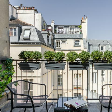 Sip coffee on the wrought iron balcony