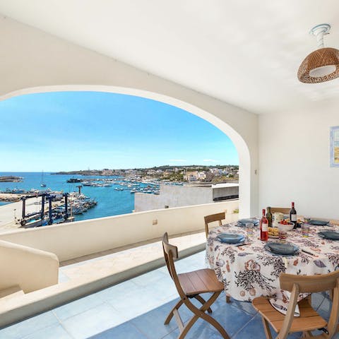 Have breakfast with a view of Leuca's sun-kissed harbour