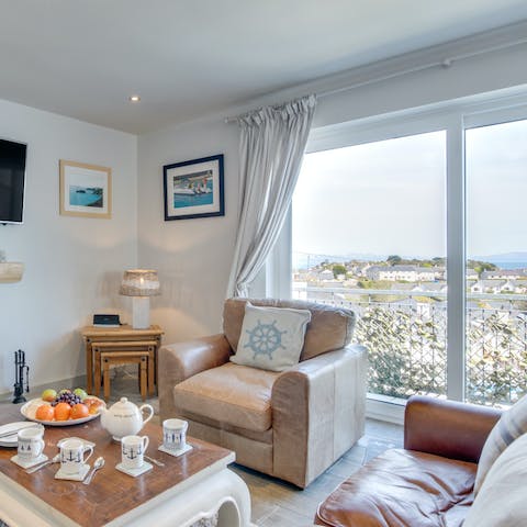 Enjoy a view of the town all the way to the sea from the living room