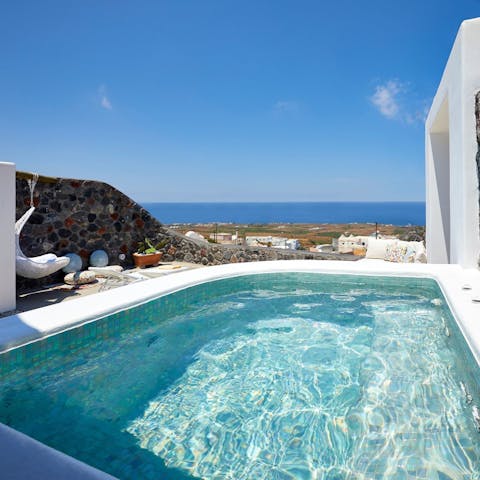 Slip into the jetted plunge pool to cool off from the Santorini heat