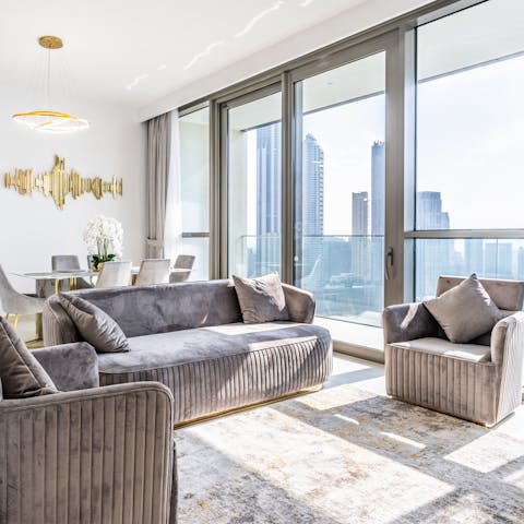 Get cosy in the stylish lounge area, with sweeping city views outside 