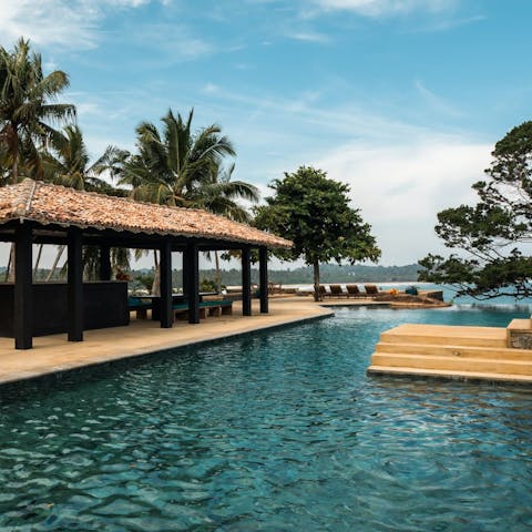 Take refreshing swims in the huge pool with ocean views 