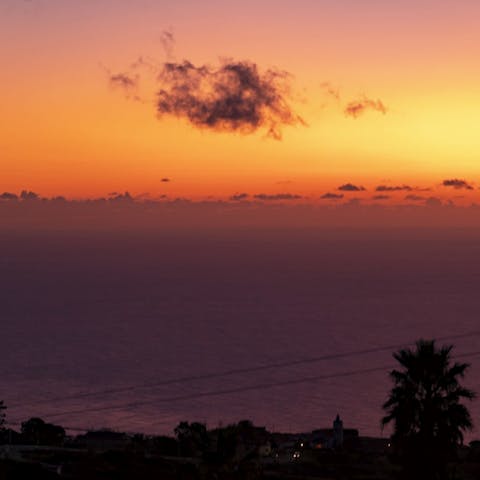 Watch the sunset over the sea from your bedroom