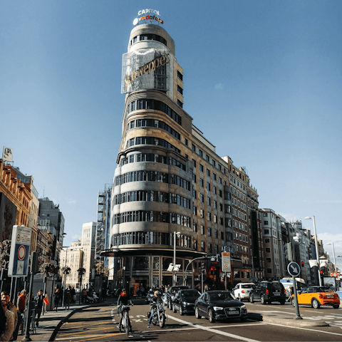 Shop along bustling Gran Vía, eighteen minutes away on foot