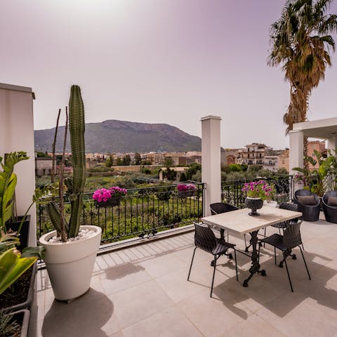 Admire the beautiful views over the Sicilian countryside and mountains from your private terrace