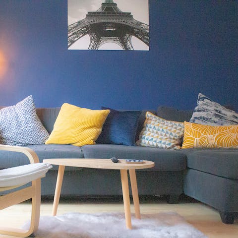Unwind on the blue chaise sofa after a day on the beach
