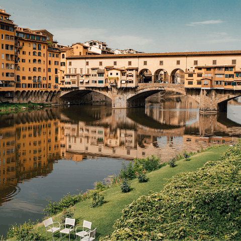Take a romantic stroll over Ponte Vecchio, a short walk away