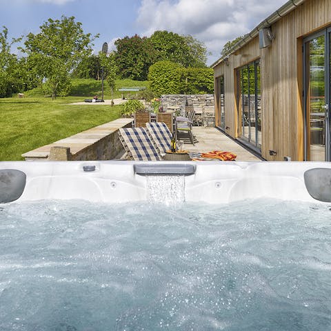 Unwind and admire the country views in the hot tub