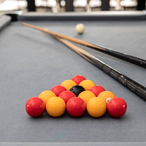 Challenge your friends to a game of billiards 