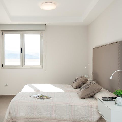 Wake up to ocean vistas in the calm, comfortable bedroom