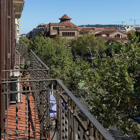 Take in leafy Eixample views from the living room's Juliet balcony